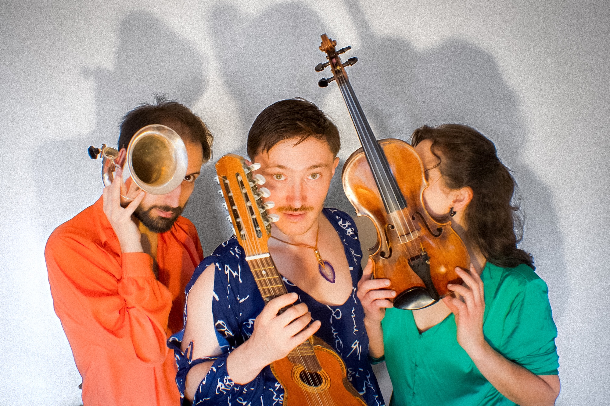 Vientos acoustic trio performing with Spanish guitar, violin, and bass clarinet in intimate folk music setting